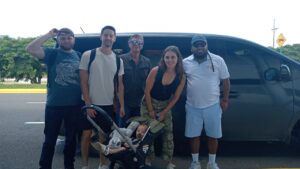 Gypsy Cab Nosara driver welcoming a family for their Liberia to Nosara shuttle at Liberia Airport